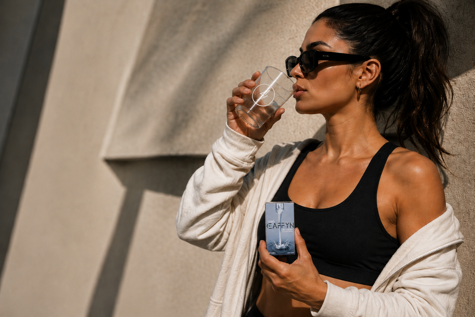 CAFFYN affiliate drinking clean energy with product packaging